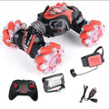 Carro Auto Acrobático 4x4 con Luces LED Recargable  Doble control Remoto Manilla Mando